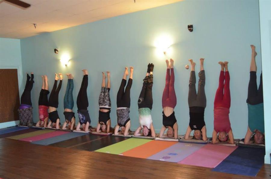 head stands in a row
